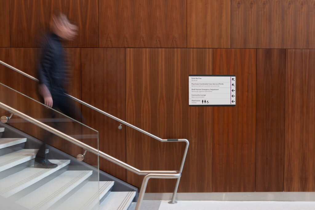Example of directional signage at the bottom of staircase.