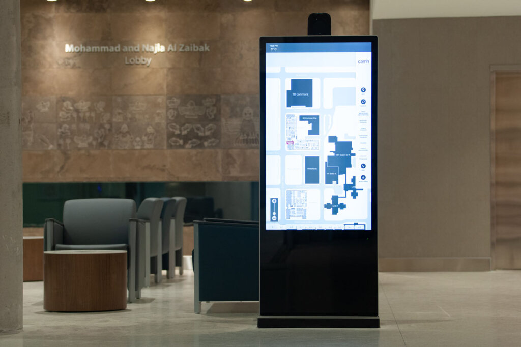 Digital screen displaying location map of the building.
