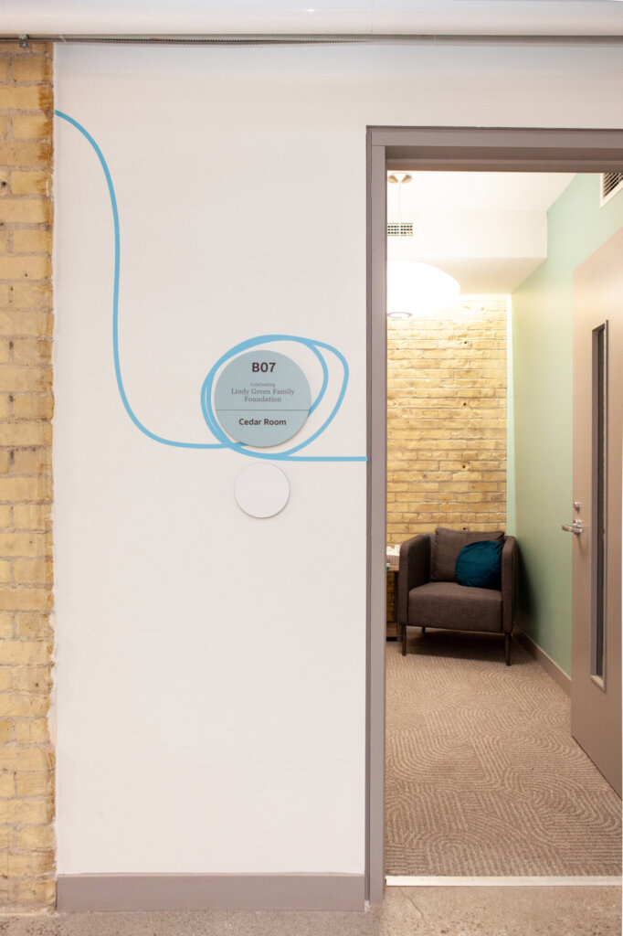 Directional signage identifying a meeting space.