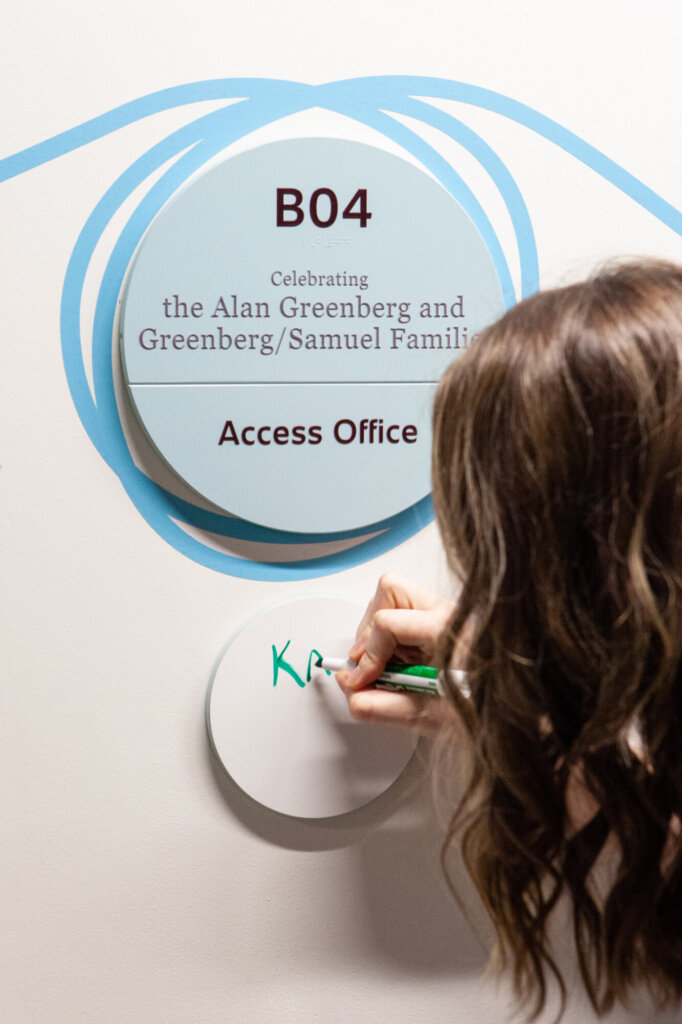 Directional signage identifying an office space.