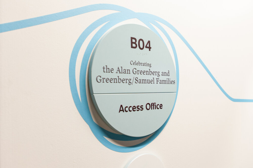 Directional signage identifying an office space.