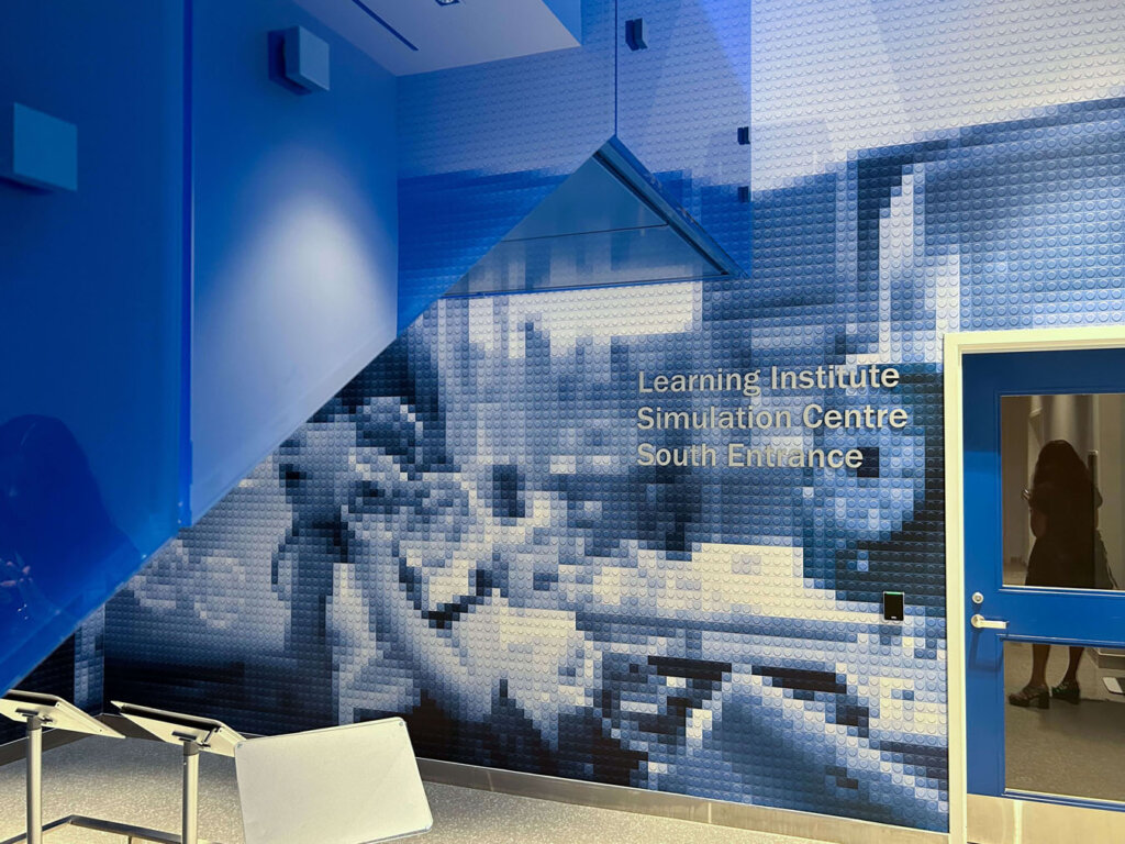 Lego inspired super graphic depicting children and bubbles.