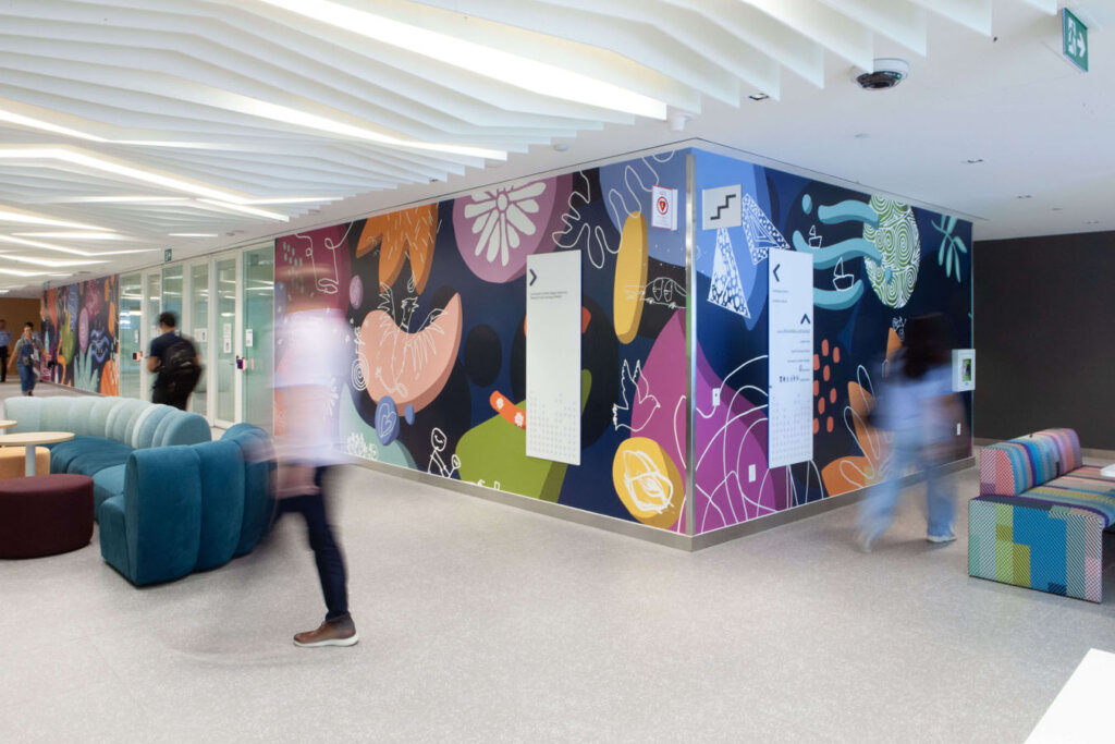 Colourful graphic mural depicting abstract shapes and patterns.
