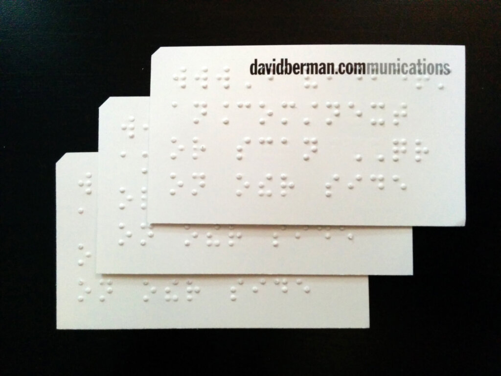 Business card example with "Berman Corner" and braille.