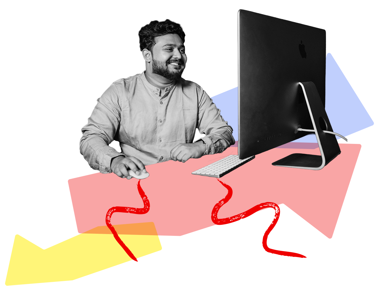 Man sitting at his desk smiling and looking at this computer screen while using a mouse