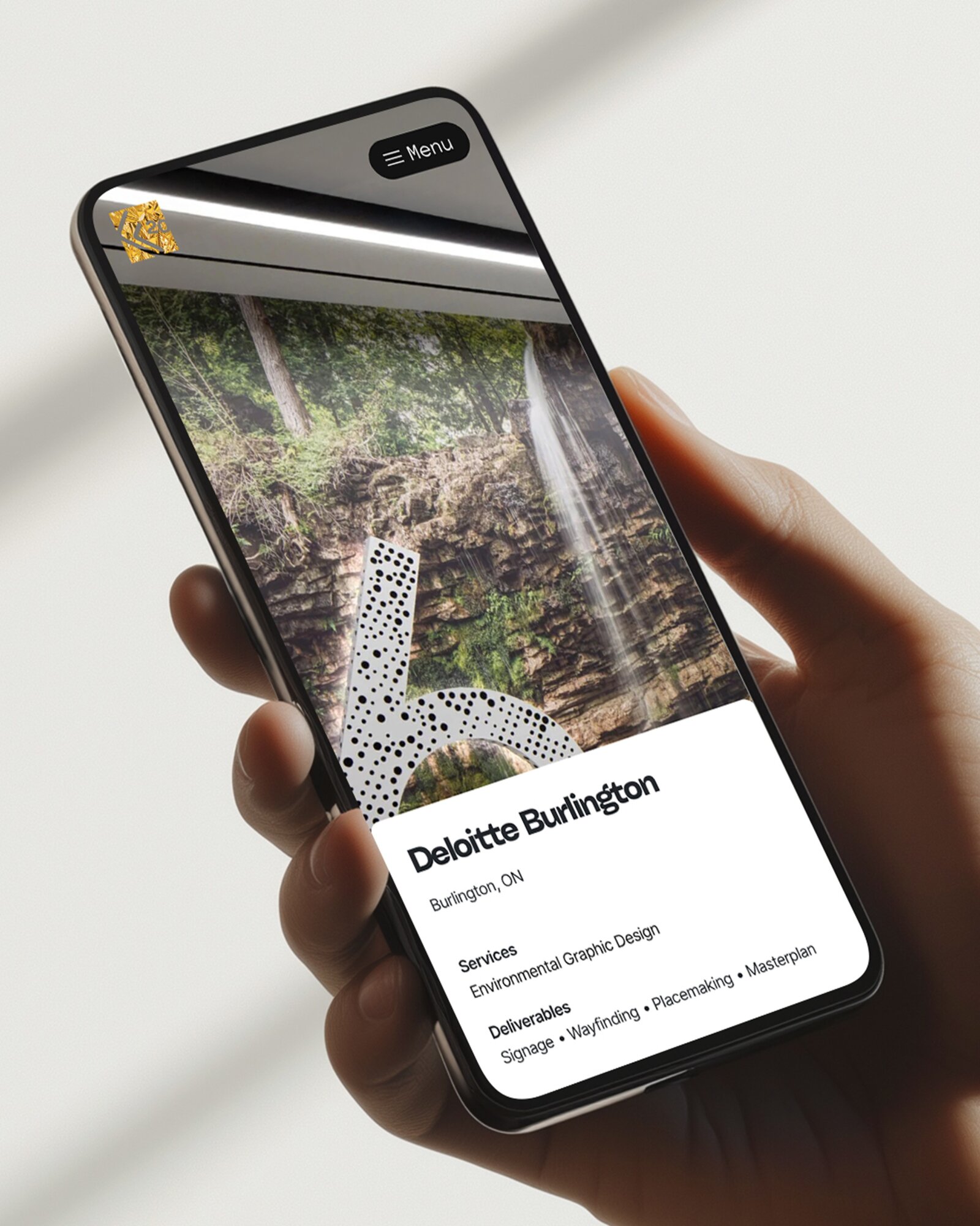 Man holding mobile phone with forgemedia.ca website displayed.