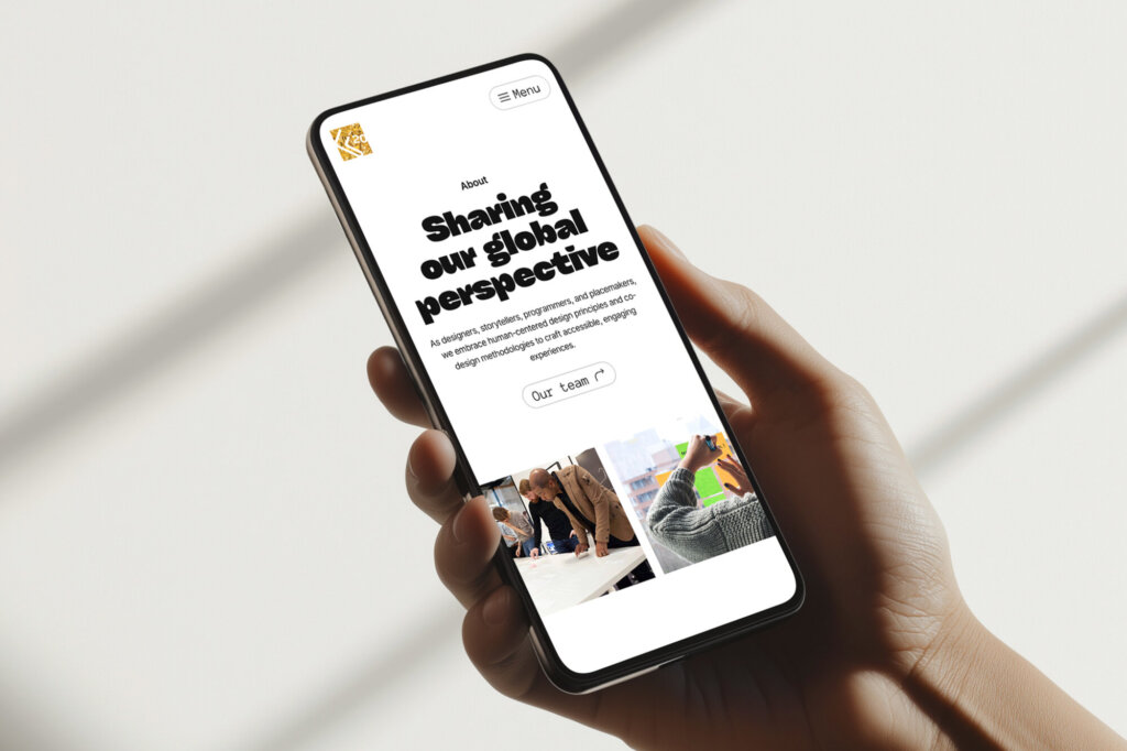 Man holding mobile phone with forgemedia.ca website displayed.