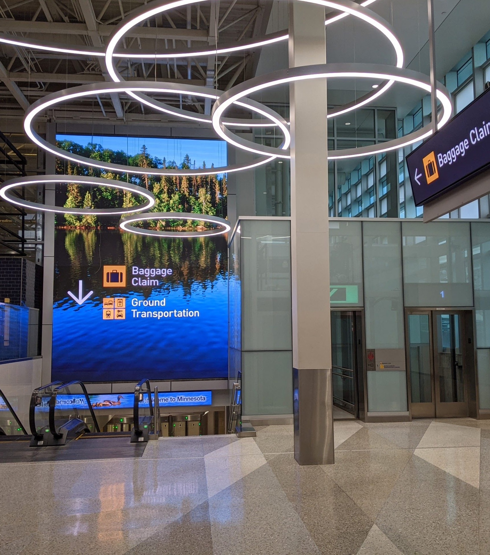 Example of signage, guiding travellers to baggage claim and ground transportation.