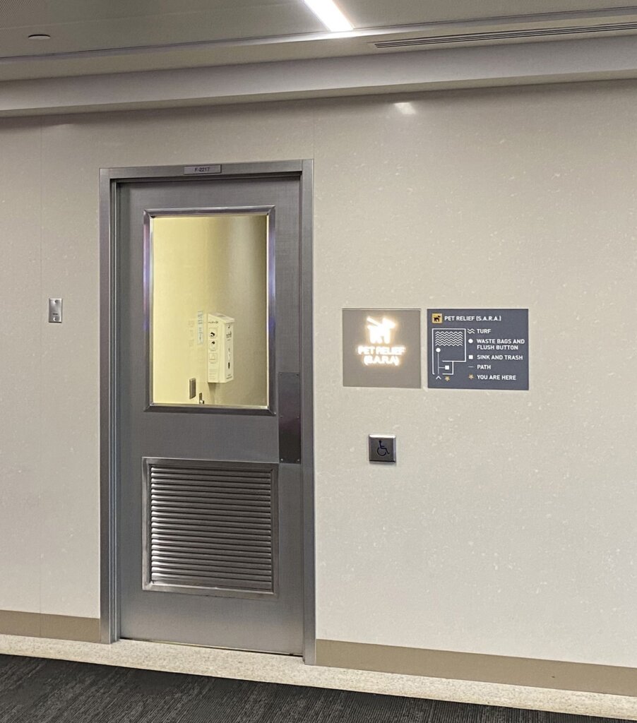 Photograph of the placement of the tactile map next to a door